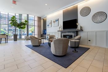 Living room with chairs and a fireplace